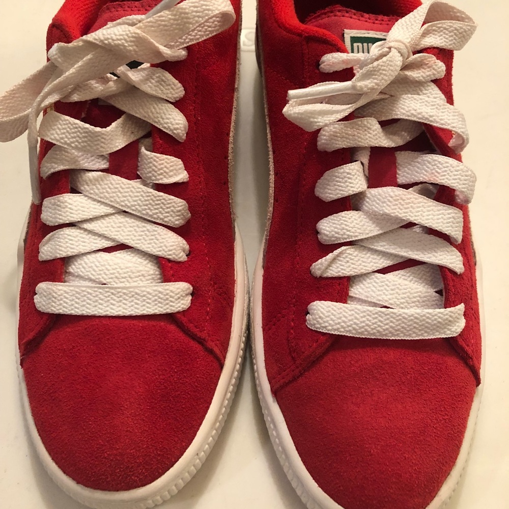 Red suede Puma sneakers